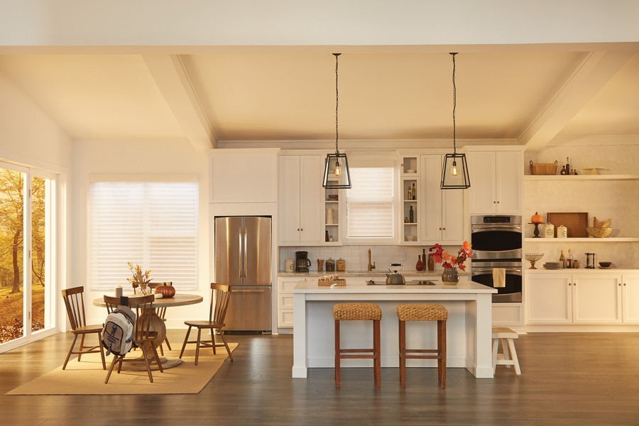 The sun-filled living area of a Yuma home enhanced with a custom lighting design. 